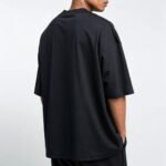 a-men-wearing-black-oversized-tshirt