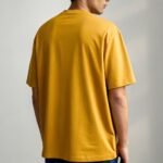 a-men-wearing-oversized-mustard-tshirt